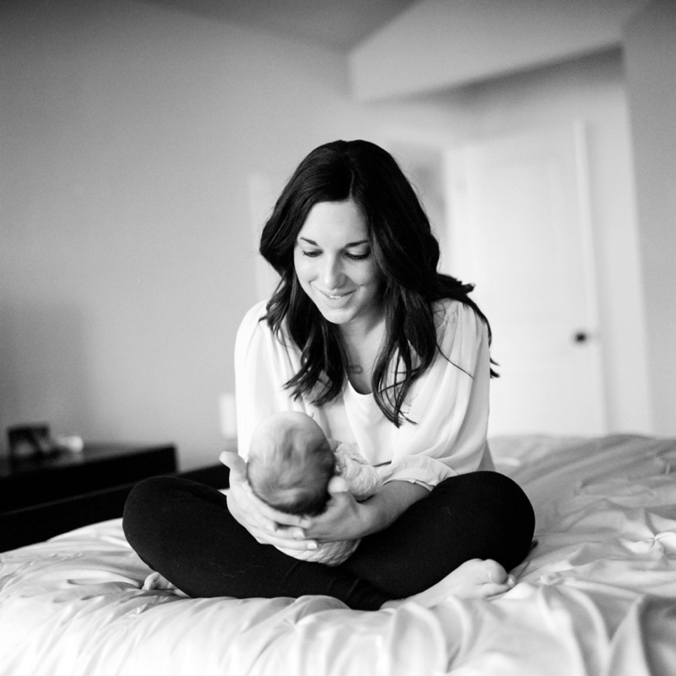 Fort Collins Family Photos: Mother And Baby On Bed