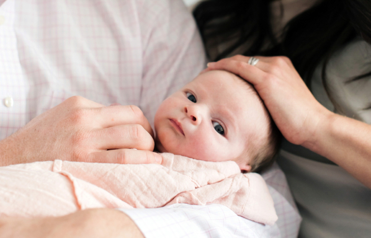 Fort Collins Family Photos: Baby Girl In Parents Arms