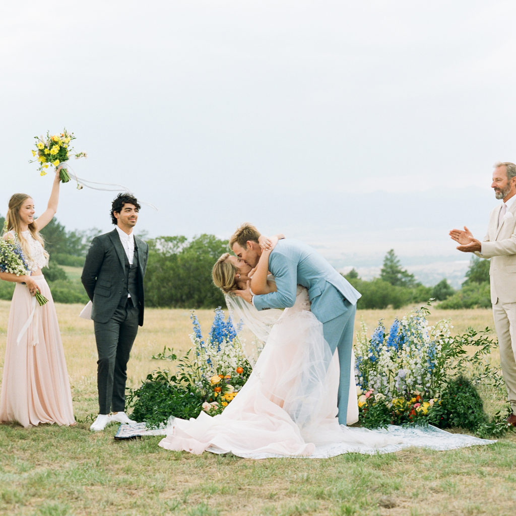 Colorado Wedding Photographers, bride groom kissing, summer Colorado mountain ceremonies,