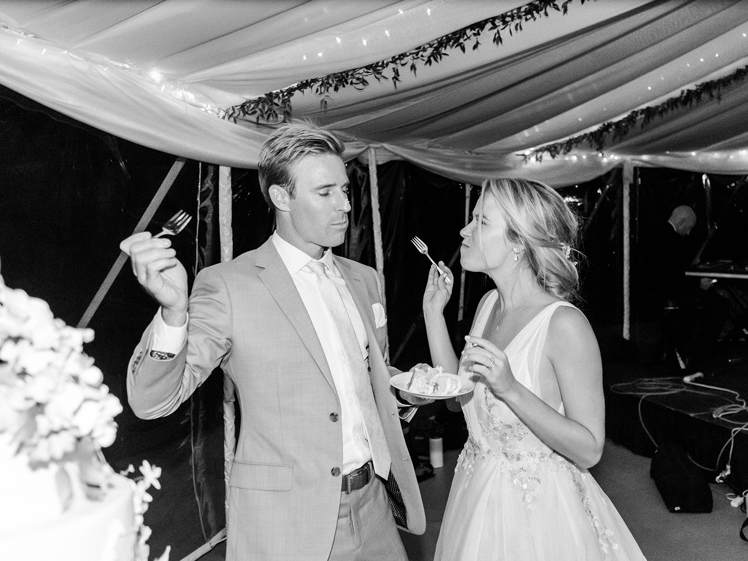 Wedding Photographers Colorado, Bride and Groom Eating Cake, Candid Moments, Black and White Wedding Photos